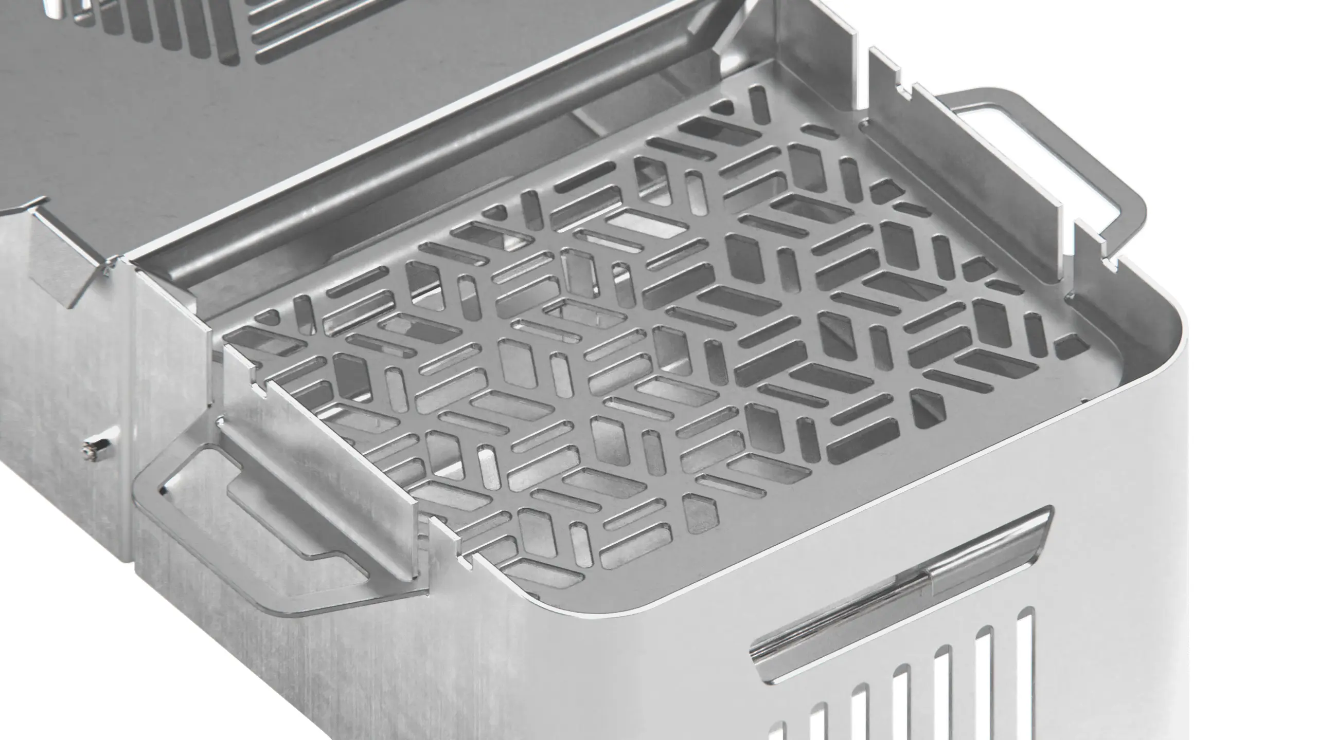 Close-up of the perforated grill plate and its cast pattern