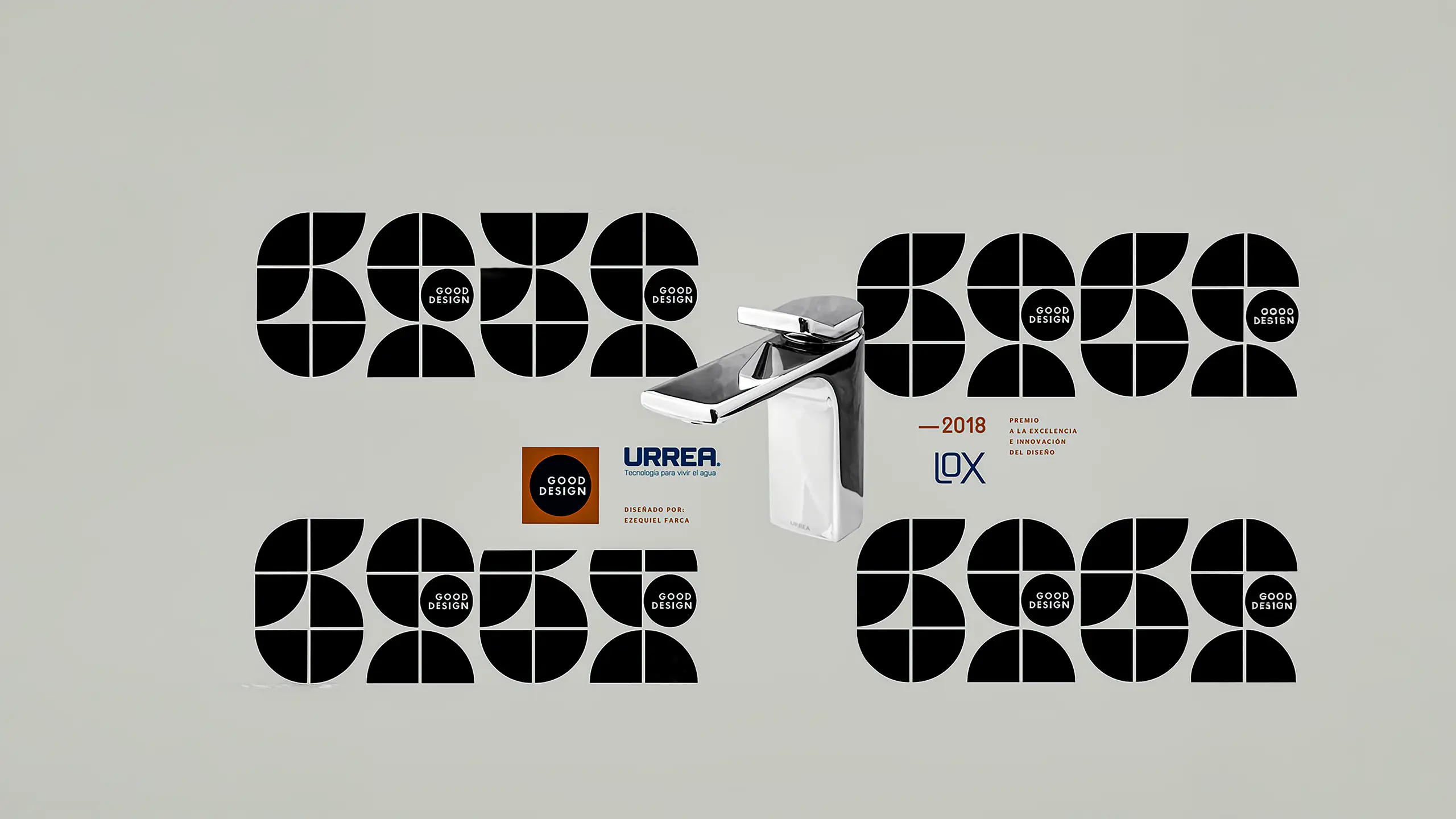 The LOX basin mixer in polished chrome, standing at the centre of the Good Design 2018 award announcement — black geometric award graphics tiled behind it, the URREA and LOX wordmarks beside it