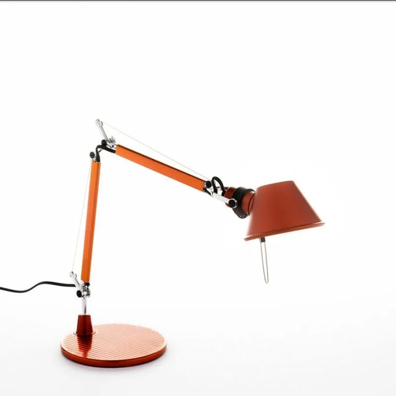 An orange counterweighted task lamp — two-part arm on tension cables over a ribbed disc base