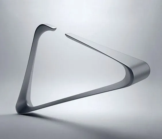 A brushed aluminium stand bent from a single strip into an open triangle