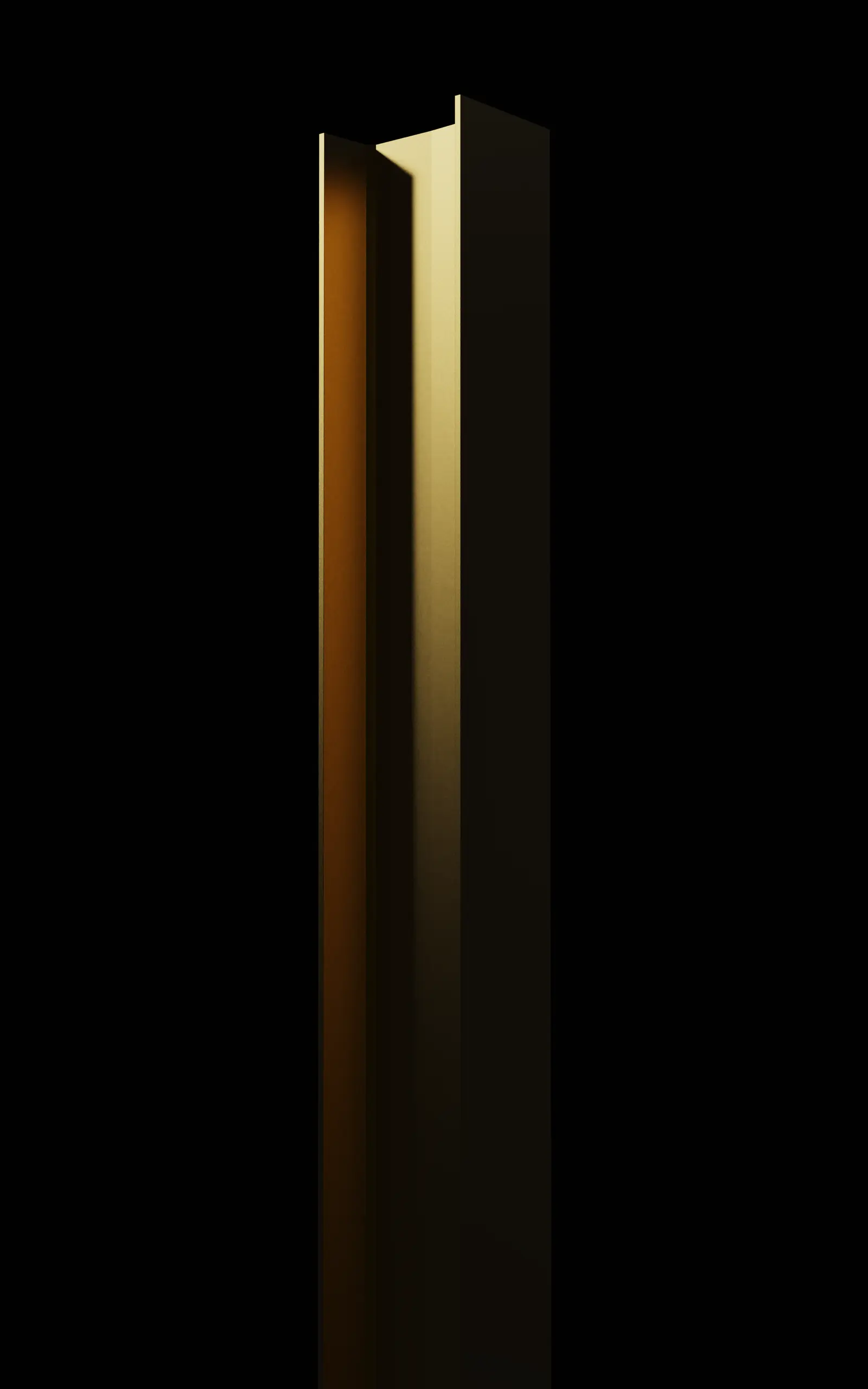 A single tall slab lit from one side against black, its edge catching a warm gold highlight