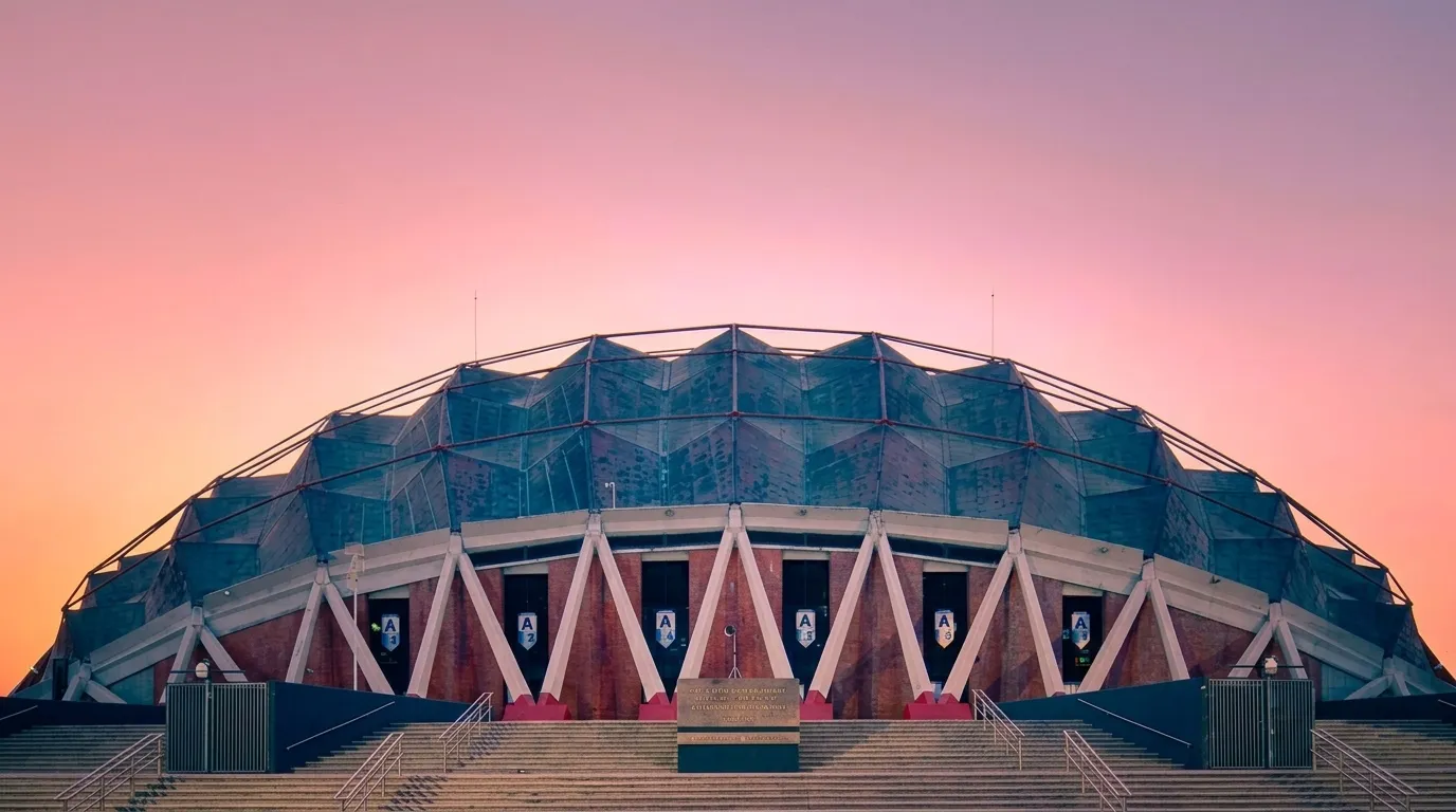 The Palacio de los Deportes from the air — its copper geodesic dome on a lattice of steel arches