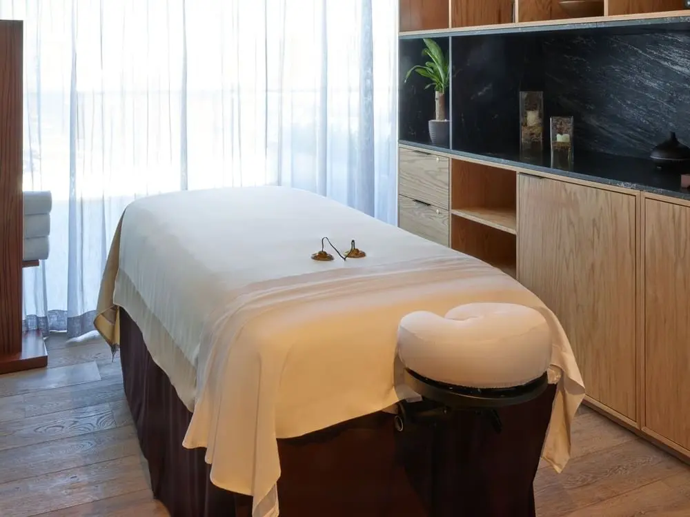 Spa treatment room, second view, with joinery and a mirrored vanity